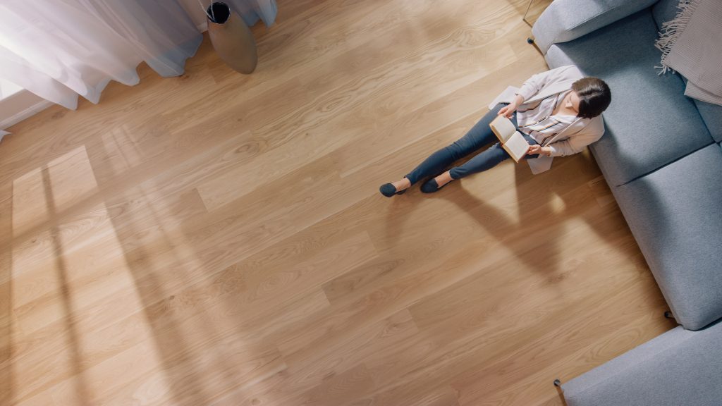 Overhead image of a client enjoying their professional hardwood flooring installation